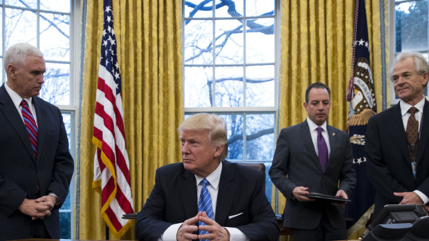 Peter Navarro (far right) in the Oval Office in 2017  with (from left) US Vice-President Mike Pence, President Donald Trump and then White House chief of staff Reince Priebus.