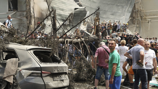 Rescuers, medical staff and volunteers clean up the rubble and search for victims.