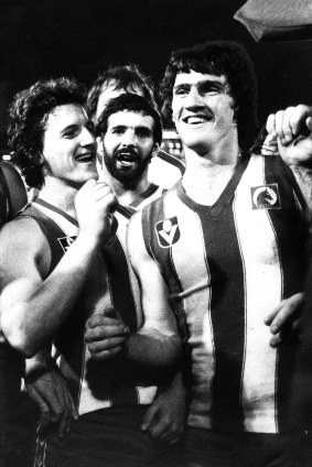 Kerry Good (right) the man who kicked the winning goal, was the dressing room hero for North Melbourne.