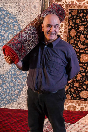 Frank Nasre inside his soon-to-be-closed rug shop in Rozelle. 