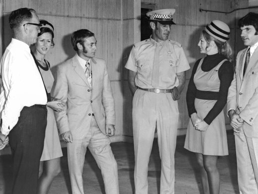 Police and crew reunite in the wake of the incident: (left to right) Unknown man, flight attendant Kaye Goreham, Captain Ralph Young, Constable Paul Sandeman who was shot four times, flight attendant Gai Rennie and the plane’s first officer Walter Gowans.