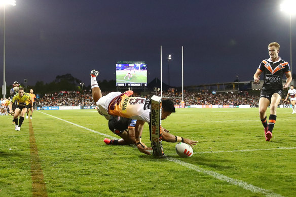 Brisbane winger Deine Mariner plants it down in the corner.