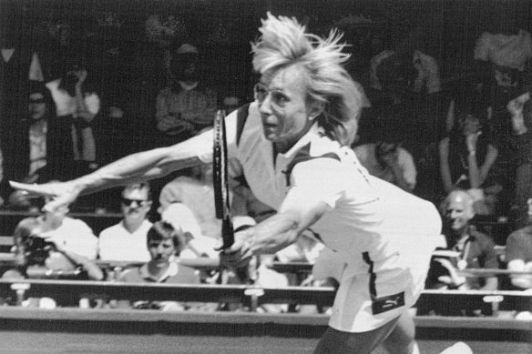 Another great leftie, Martina Navratilova, at full stretch at Wimbledon in 1987.
