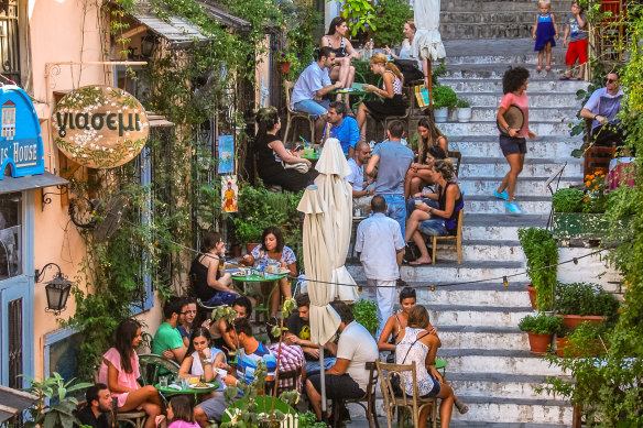 Local icon: diners line the Plaka Stairs.