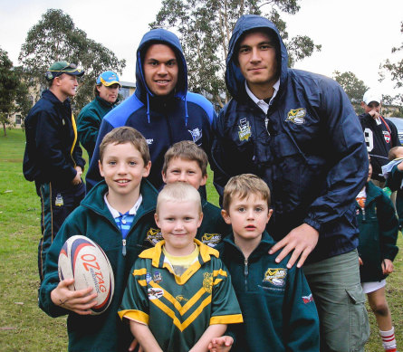 A young Cameron Murray (left, holding the ball) with Sonny Bill Williams (right) at a school clinic.