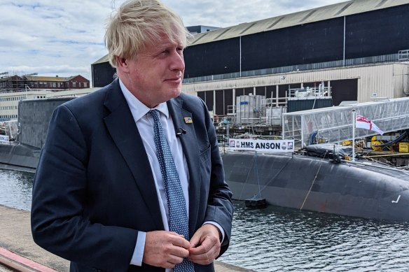 UK Prime Minister Boris Johnson attends the commissioning of HMS Anson, Britain’s newest Astute-class submarine, at the BAE Systems shipyards in Barrow, England on Wednesday.