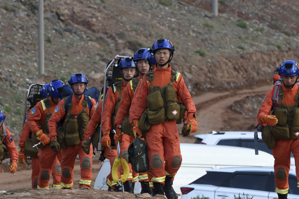 Rescuers walk into the accident site to search for survivors in Jingtai County of Baiyin City, northwest China’s Gansu Province.