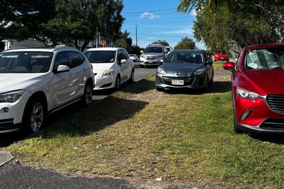 Cars parked on the verge at Norman Park. In Brisbane, motorists can be fined $116 for the offence “stop on footpath, shared path, dividing strip or nature strip”.