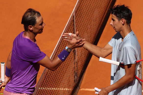 Rafael Nadal (left) shakes hands after a win over Australian Alexei Popyrin in Madrid recently.