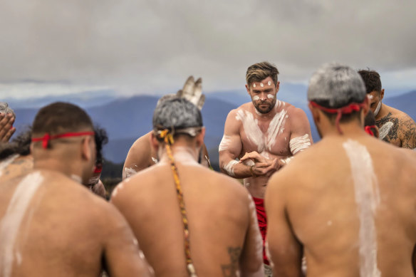 A scene from Limitless showing actor Chris Hemsworth as the focal point during the cultural ceremony.