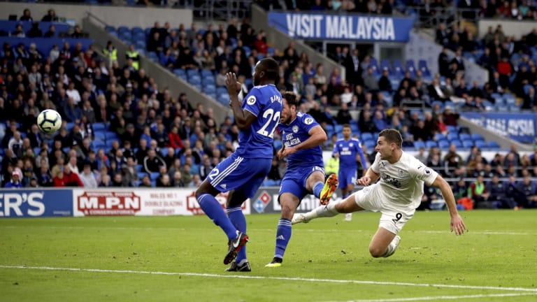 Burnley's Sam Vokes scores against Cardiff City in Cardiff on Sunday.