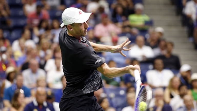 Power and passion: Millman unleashes a forehand in his memorable win.