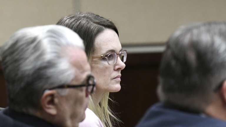 Denise Williams listens to opening statements made by prosecutors during her trial on Tuesday.