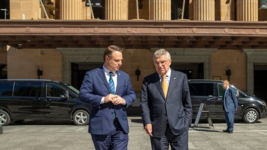 IOC president Thomas Bach (right) and Brisbane Lord Mayor Adrian Schrinner are seen taking a quick tour outside the Brisbane City Hall.