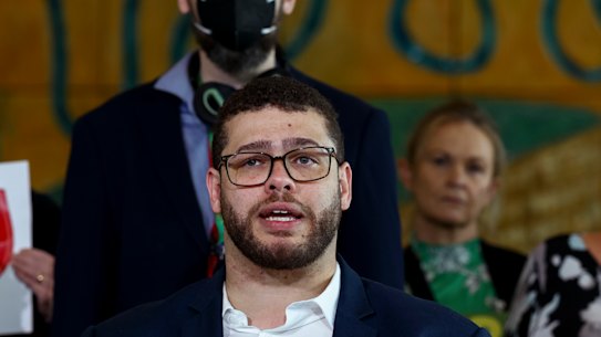 Greens senator Jordon Steele-John alongside NDIS advocates during a post budget press conference at Parliament House.