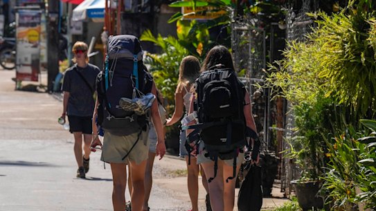 Backpacker tourists roam around in Vang Vieng, Laos.