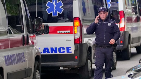Police block the street around the Vladislav Ribnikar school in Belgrade, Serbia, on Wednesday.