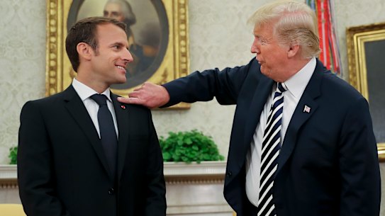 Trump brushes dandruff off 'perfect' Macron before issuing Iran warning