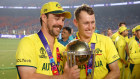 Travis Head and Marnus Labuschagne pose with the World Cup Trophy.