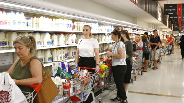 Shoppers rush to stock up on groceries in Brisbane this morning ahead of a three-day lockdown. 