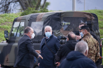 Anti-mafia prosecutor Nicola Gratteri (left) stands by military personnel outside a specially constructed bunker on the occasion of the first hearing of a maxi-trial against more than 300 defendants of the ’Ndrangheta crime syndicate, near the Calabrian town of Lamezia Terme, southern Italy.
