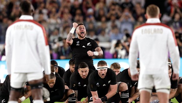 Challenge: England eyeball the haka lead by substitute All Blacks halfback TJ Perenara.