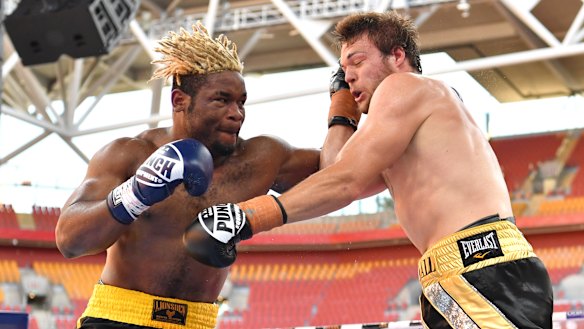 Brisbane bout: Christian Ndzie Tsoye (left) lands a punch on Joseph Goodall during their heavyweight fight at Suncorp Stadium in November.