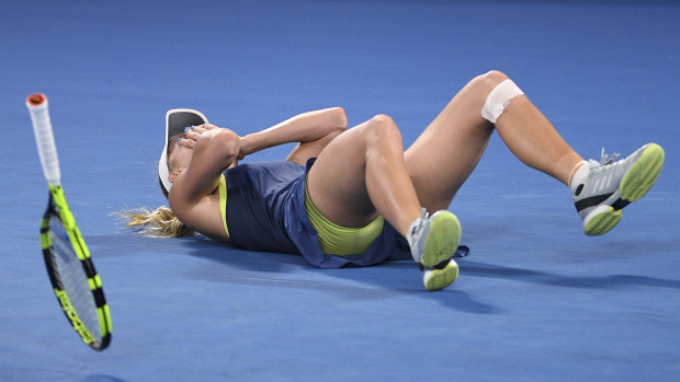 Thriller: Caroline Wozniacki celebrates her Australian Open win over Simona Halep.