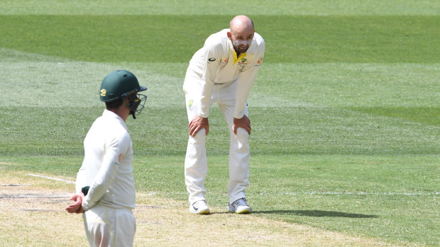 Nathan Lyon reacts after a dropped chance off his bowling.