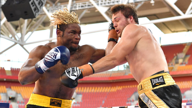 Brisbane bout: Christian Ndzie Tsoye (left) lands a punch on Joseph Goodall during their heavyweight fight at Suncorp Stadium in November.