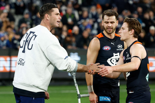 Tom Hawkins finished Friday night’s game on crutches with a concerning mid-foot injury.