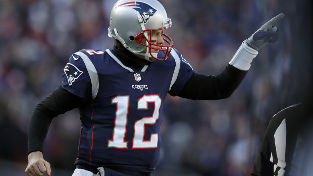 Patriots quarterback Tom Brady celebrates a team touchdown against the Chargers.