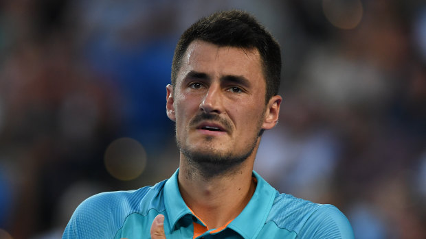 Bernard Tomic lost to Marin Cilic during day one of the Australian Open before launching a verbal attack on Lleyton Hewitt.