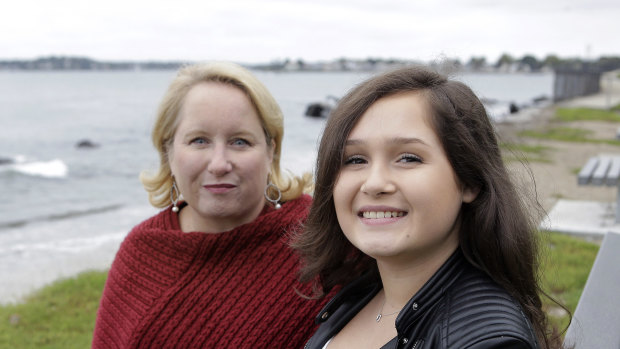 Jeanne Talbot, left, and her transgender daughter Nicole Talbot, 17, both of Beverly, Massachusetts, sit for a photograph at a park.