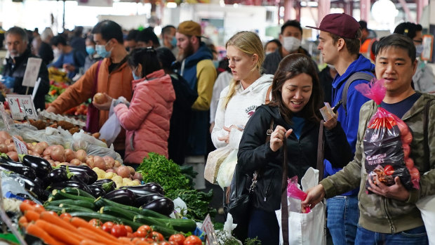 People shop at the Queen Victoria Market on Saturday.