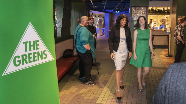 Victorian Greens leader Samantha Ratnam (third from left) arrives with Greens MP Ellen Sandell at the party's election night reception.
