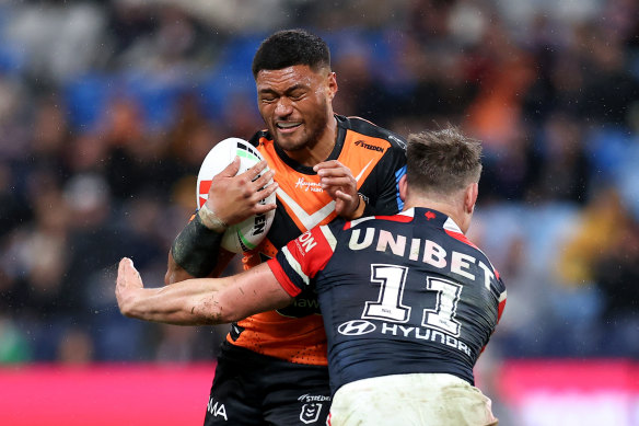 Stefano Utoikamano hits it up against the Roosters.