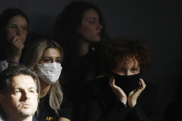 Show-goers at Dolce & Gabbana's parade at Milan Fashion Week. Several shows were cancelled or held behind closed doors due to virus fears.