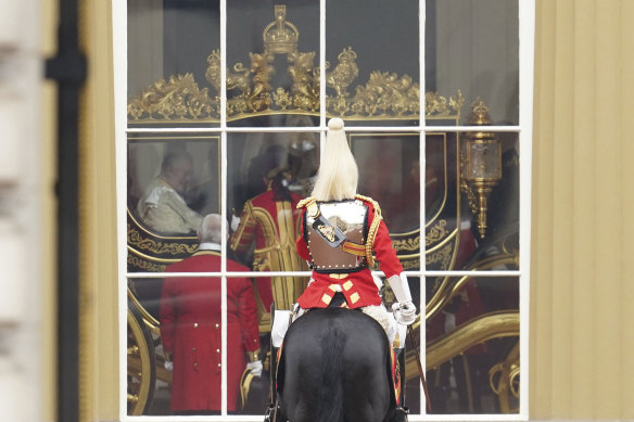 King Charles III in the Diamond Jubilee State Coach at Buckingham Palace ahead of the coronation ceremony.

