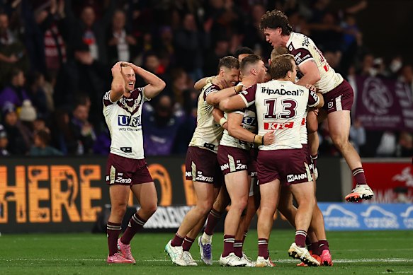 Manly players celebrate after beating Melbourne.