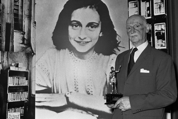 In this 1971 photo Dr Otto Frank holds the Golden Pan award, given for the sale of one million copies of the famous paperback “The Diary of Anne Frank”.
