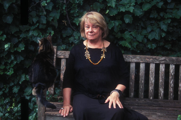 Marion Halligan with her cat in her garden. 