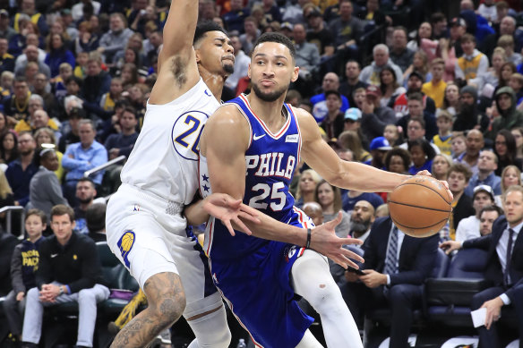 The 76ers' Ben Simmons dribbles the ball against the Pacers.