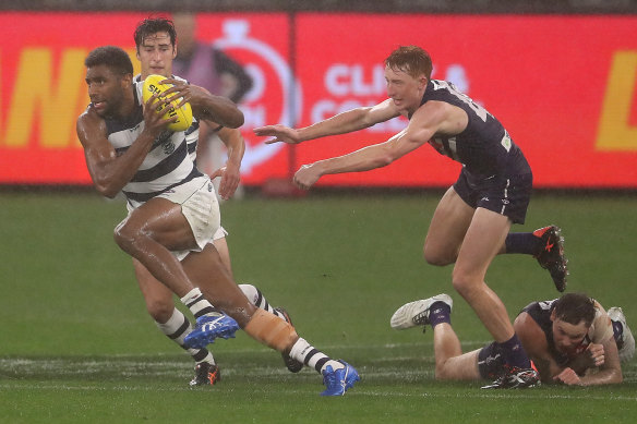 Geelong's Esava Ratugolea breaks away in the wet conditions.
