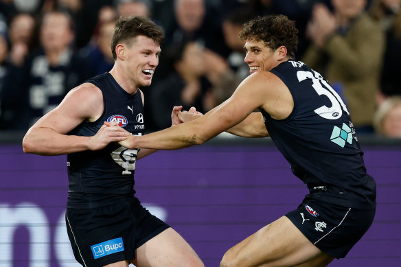 Tag team: Sam Walsh and Charlie Curnow celebrate last weekend, but it’s back to business against the Demons.