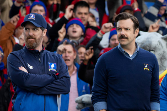 Brendan Hunt as Coach Beard and Jason Sudeikis as Ted Lasso in the second season of the show that was spawned by an ad.