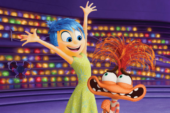 Joy (voiced by Amy Poehler) welcomes new emotion Anxiety (Maya Hawke) in Inside Out 2. 