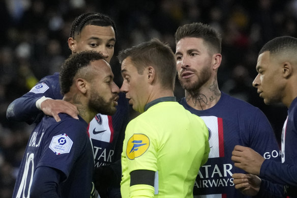 Neymar comes face-to-face with referee Clement Turpin after being shown a red card.