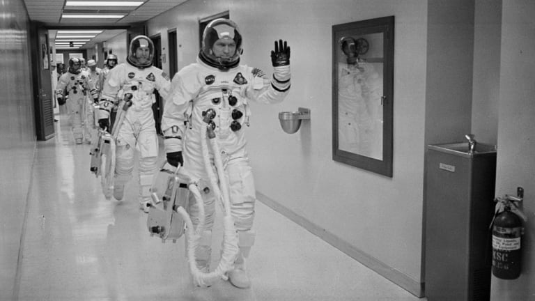 Commander Col. Frank Borman leads the way to the launch pad at the Kennedy Space Center in Florida. 