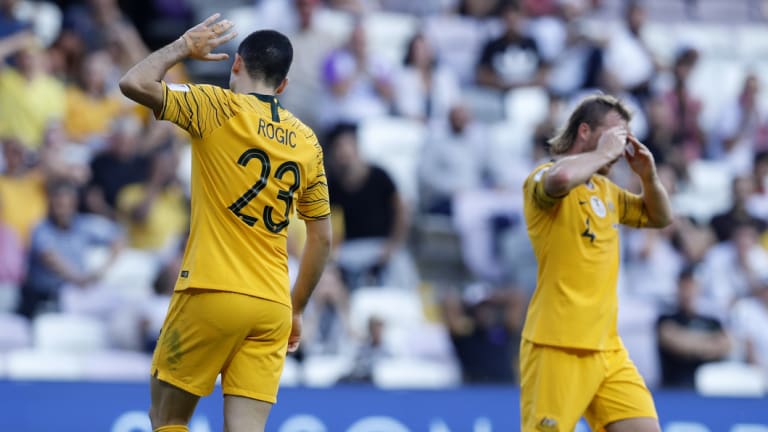 Off night: Australia's Tom Rogic, left, and teammate Ryan Grant lament a missed chance.